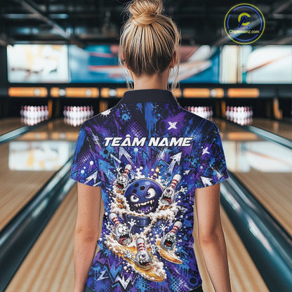 Female model wearing a blue and purple bowling quarter-zip shirt from the back at a bowling lane, displaying a blue monster bowling ball leading monster bowling pins with overflowing beer mugs and bold graffiti-style splatter artwork.