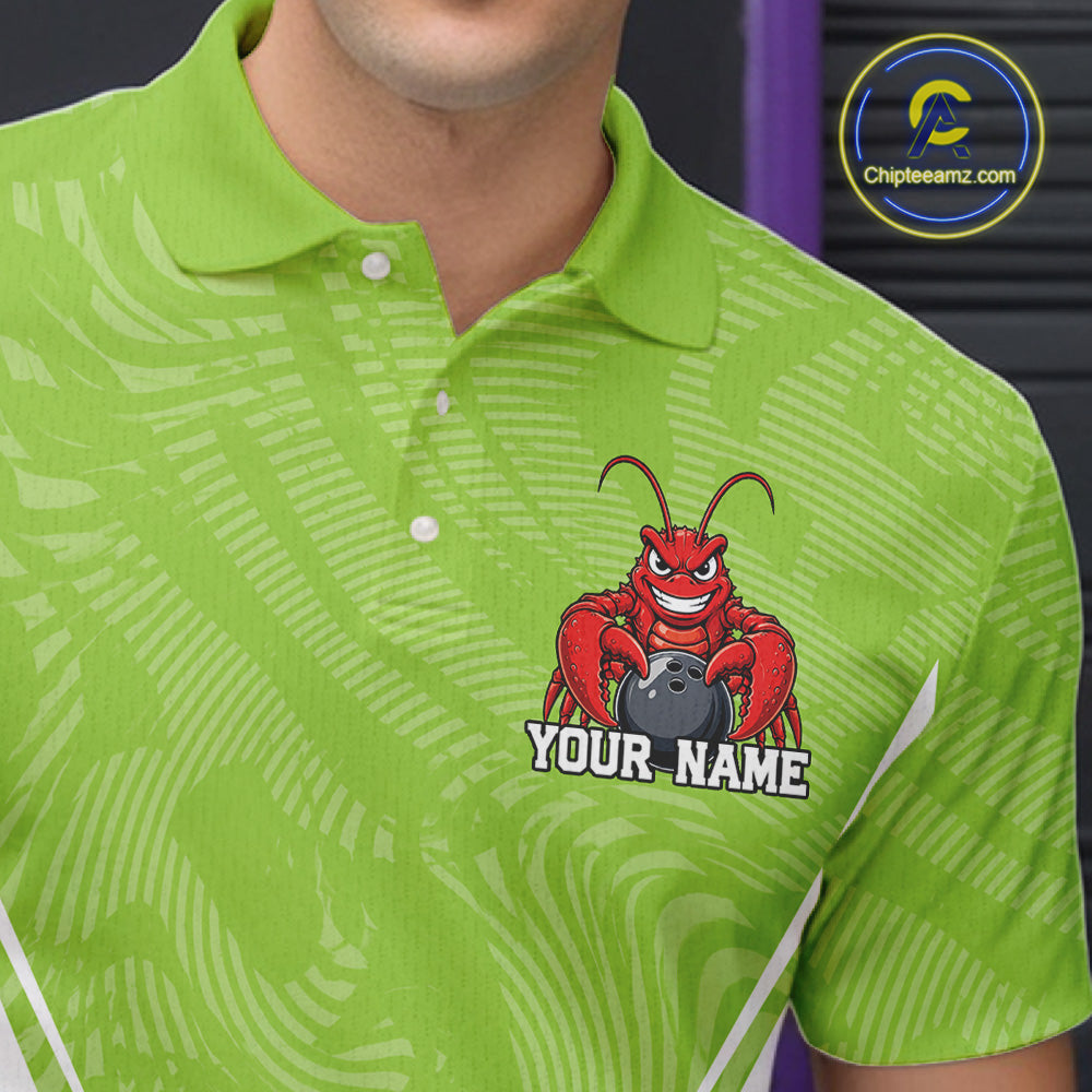 Close-up front view of the left chest area on a light green custom bowling polo shirt featuring a funny aggressive crawfish holding a bowling ball in a sportswear-style design.