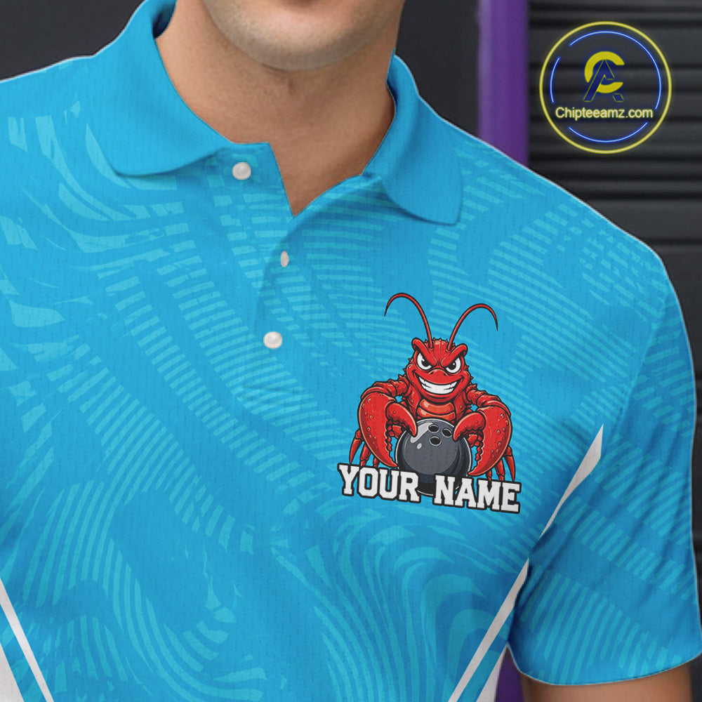 Close-up front view of the left chest area on a blue custom bowling polo shirt featuring a funny aggressive crawfish holding a bowling ball in a sportswear-style design.