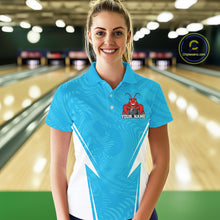 Load image into Gallery viewer, Front view of a female model in a bowling alley wearing a blue custom bowling polo shirt with a funny aggressive crawfish holding a bowling ball in a sportswear-style design.