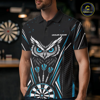 Front view of a man wearing a black darts polo shirt with blue accents, featuring fierce owls framed by dartboards, three darts, and personalized name areas.