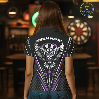 Back view of a woman wearing a black darts polo shirt with purple accents, featuring fierce owls framed by dartboards, three darts, and personalized name areas.