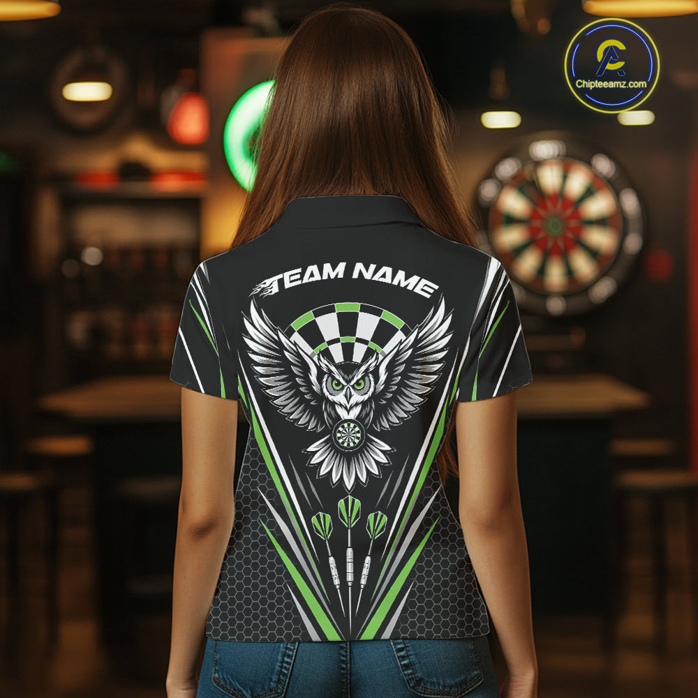 Back view of a woman wearing a black darts polo shirt with green accents, featuring fierce owls framed by dartboards, three darts, and personalized name areas.