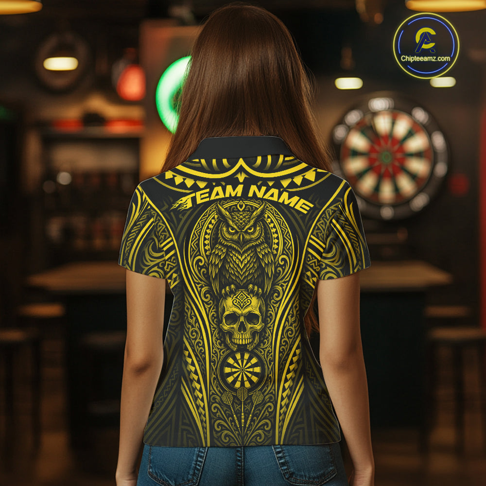 A woman viewed from behind wearing a short-sleeve shirt with a large yellow tribal-style graphic