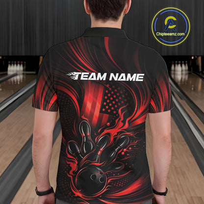 Front view of a male model in a bowling alley wearing a black and red polo featuring a flaming bowling ball and pin strike design.