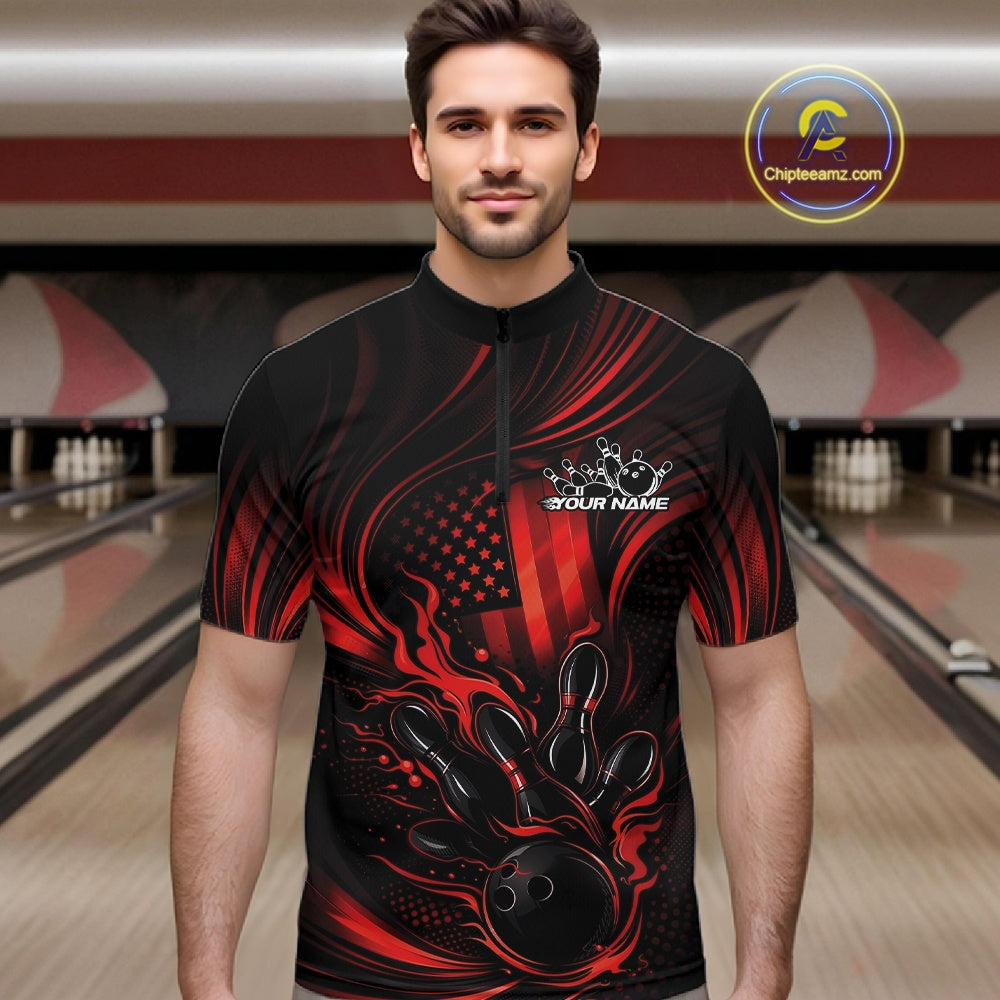 Male model at a bowling lane wearing a black and red bowling quarter-zip shirt with patriotic bowling strike graphics and bold flame details.
