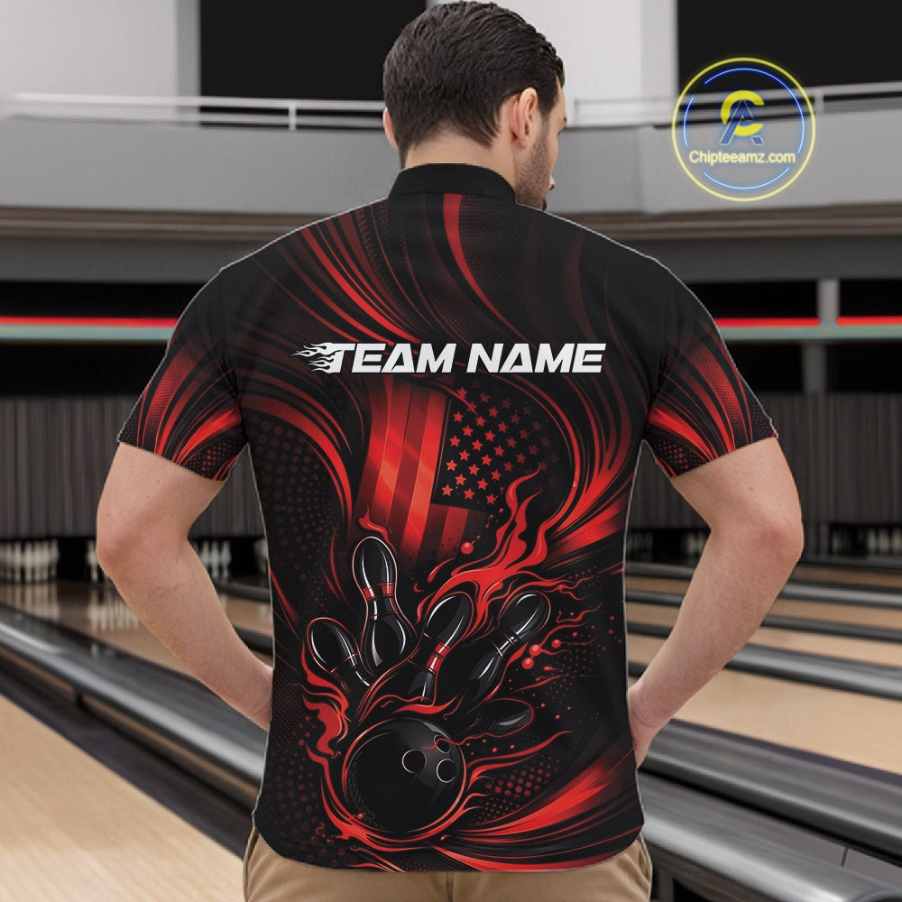 Front view of a male model in a bowling center wearing a black and red quarter-zip shirt featuring flaming bowling action artwork and patriotic styling.
