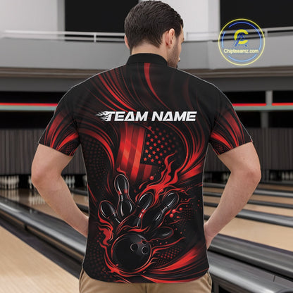 Front view of a male model in a bowling center wearing a black and red quarter-zip shirt featuring flaming bowling action artwork and patriotic styling.