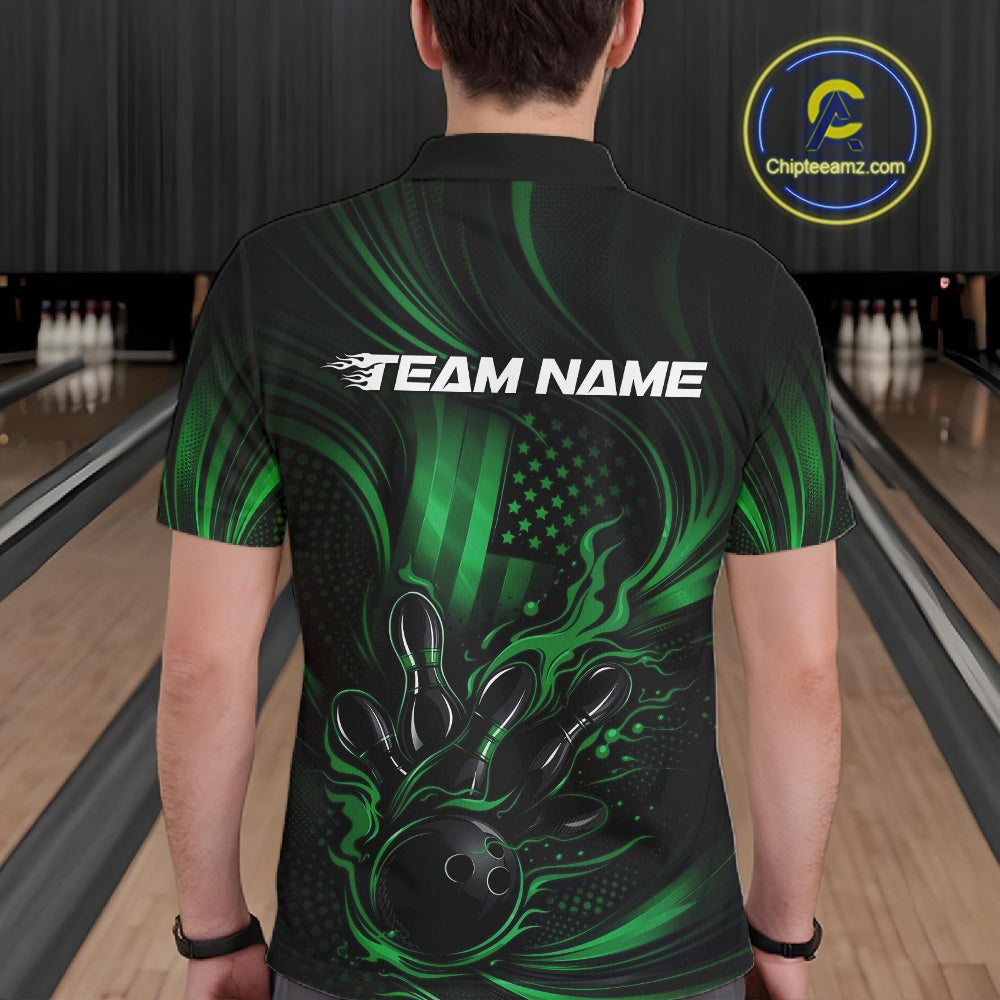 Back view of a male model in a bowling alley wearing a black and green polo featuring flaming bowling ball and American flag graphics.