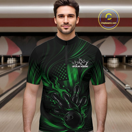 Male model wearing a black and green bowling quarter-zip shirt at a bowling lane with patriotic bowling strike graphics and distressed flag accents.