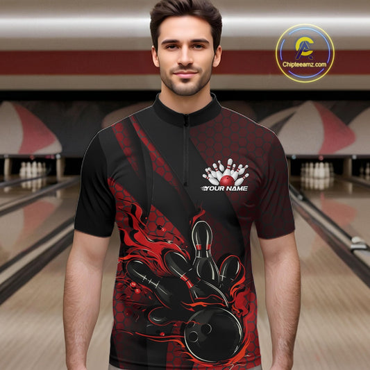 Male model wearing a black and red bowling quarter-zip shirt at a bowling lane with fiery bowling action artwork and geometric accents.