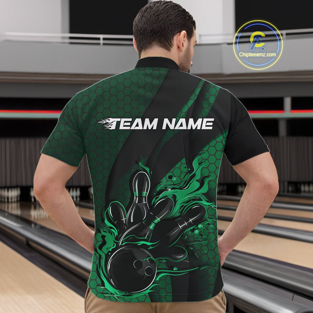 Front view of a male model in a bowling alley wearing a black and green quarter-zip shirt featuring a bowling strike graphic with geometric details.