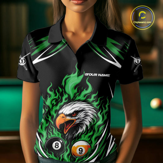 A woman wearing black and green custom polo shirt featuring a flaming eagle surrounded by billiard 8 and 9 balls.
