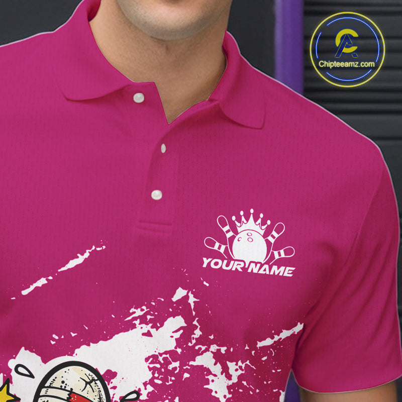 Close-up view of left chest area of a pink and white polo shirt, showing small boxing bowling ball and pin graphic detail.