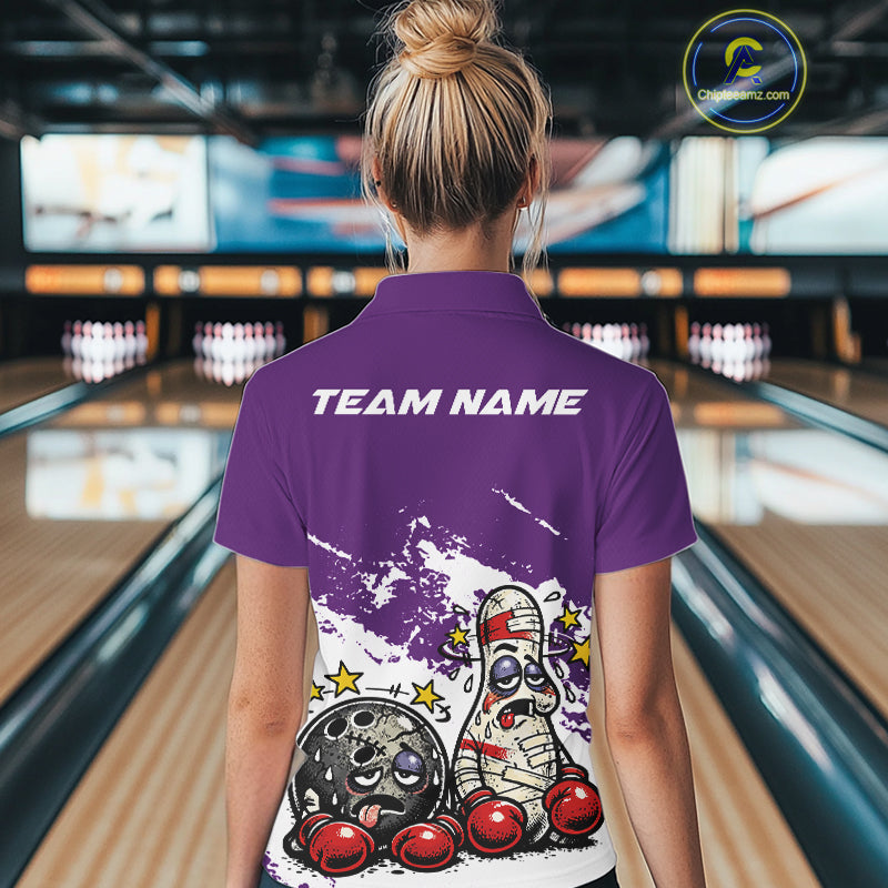 Back view of a female bowler wearing a purple and white polo shirt, boxing-style bowling ball and pin graphic with fun design.