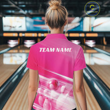 Load image into Gallery viewer, Back view female model at the bowling lane wearing a pink polo shirt with bowling ball and pins over a pink geometric background.