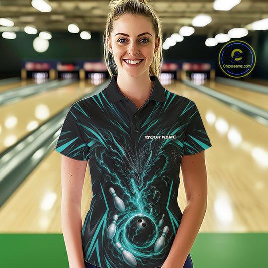 A woman wearing a black short-sleeve bowling-themed polo shirt with a teal and black dragon design and bowling pins graphic