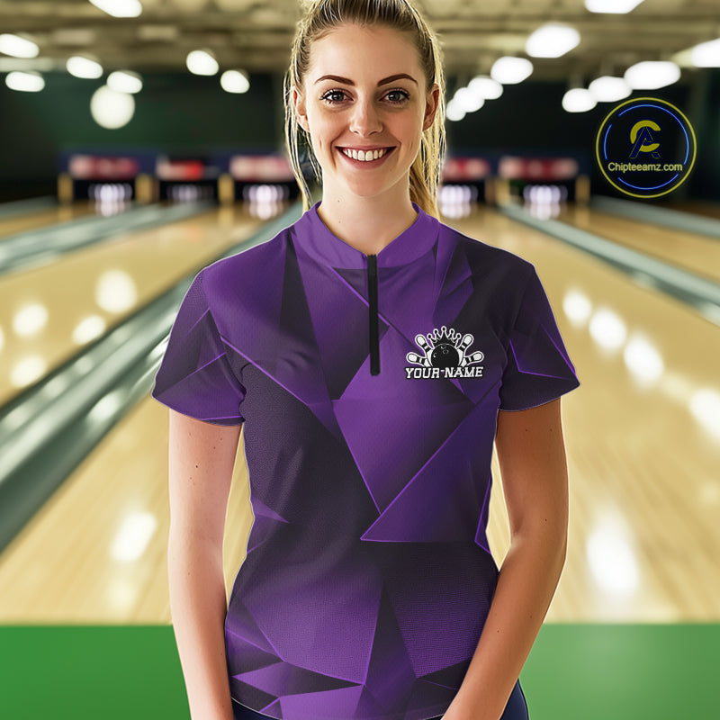 Woman wearing a purple bowling shirt with a personalized design in a bowling alley.