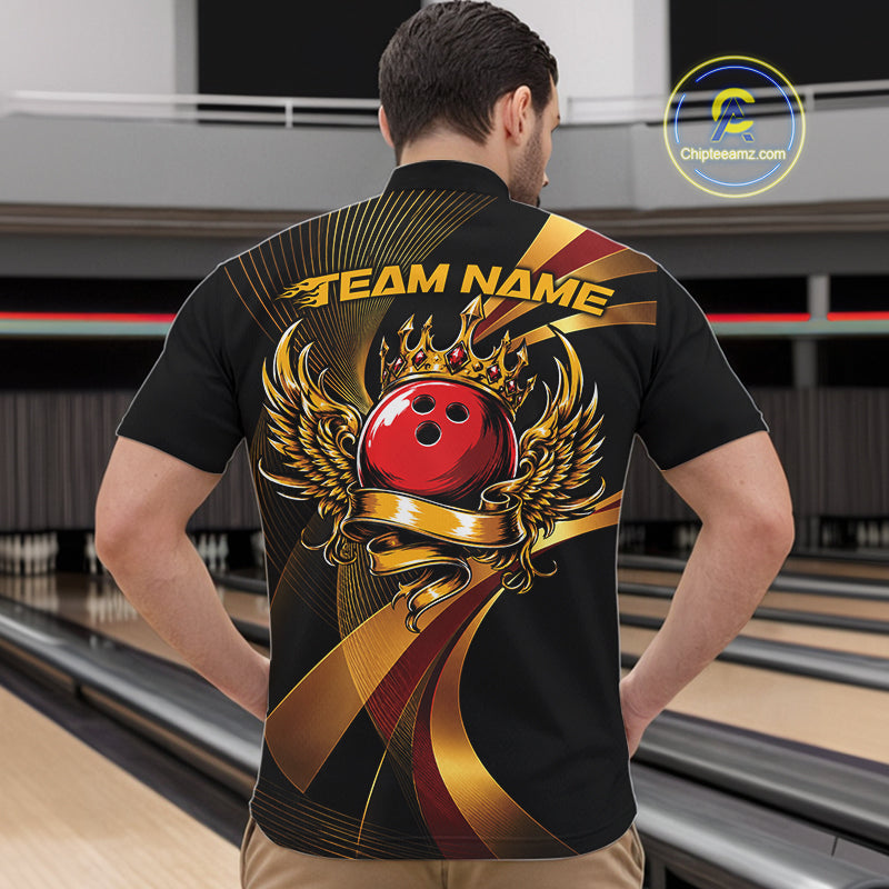 Person wearing a black bowling shirt with a red bowling ball design in a bowling alley.