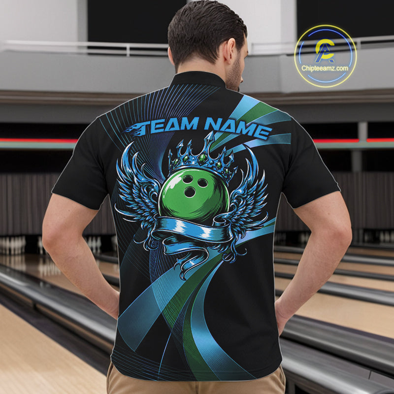 Person wearing a black bowling shirt with a green bowling ball design in a bowling alley.