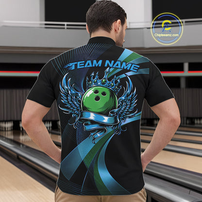 Person wearing a black bowling shirt with a green bowling ball design in a bowling alley.