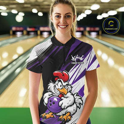A woman standing in a bowling alley wearing a custom short-sleeve bowling shirt with a black and purple design, a cartoon chicken holding a purple bowling ball, and a white crown graphic with the text 'YOUR NAME'.
