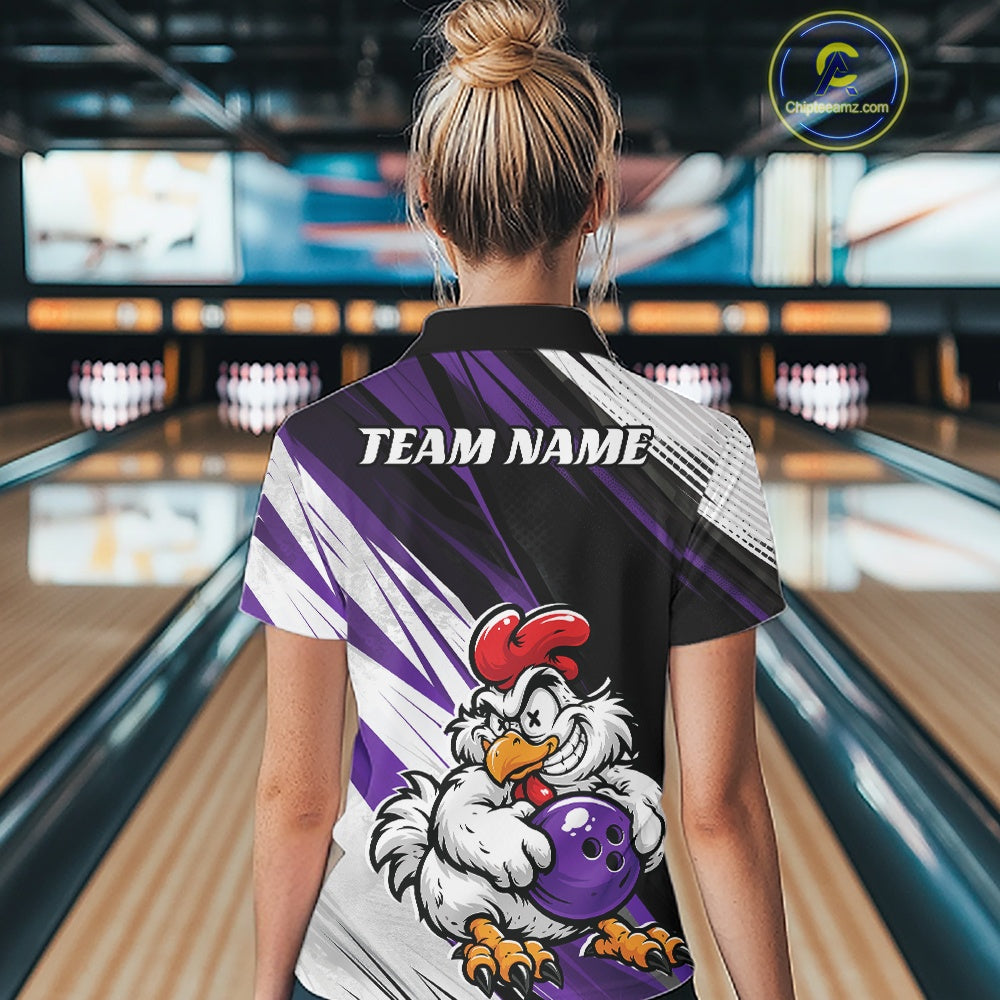 A woman viewed from behind wearing a custom bowling shirt in a bowling alley. The shirt features a black collar, purple and white graphic stripes, and a cartoon chicken mascot holding a purple bowling ball.