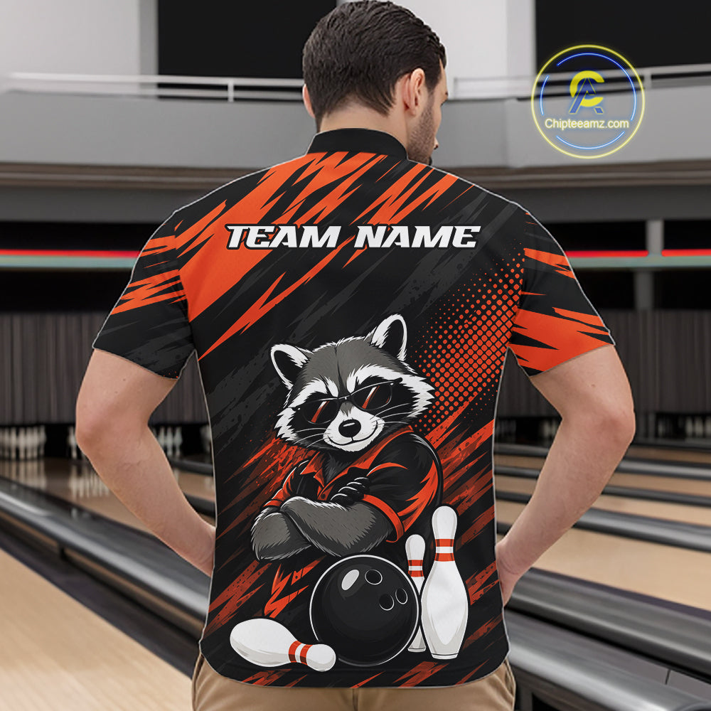 A man viewed from behind wearing a custom bowling-themed short-sleeve quarter zip shirt with a raccoon graphic and 'TEAM NAME' text on the back, set against a bowling alley background.