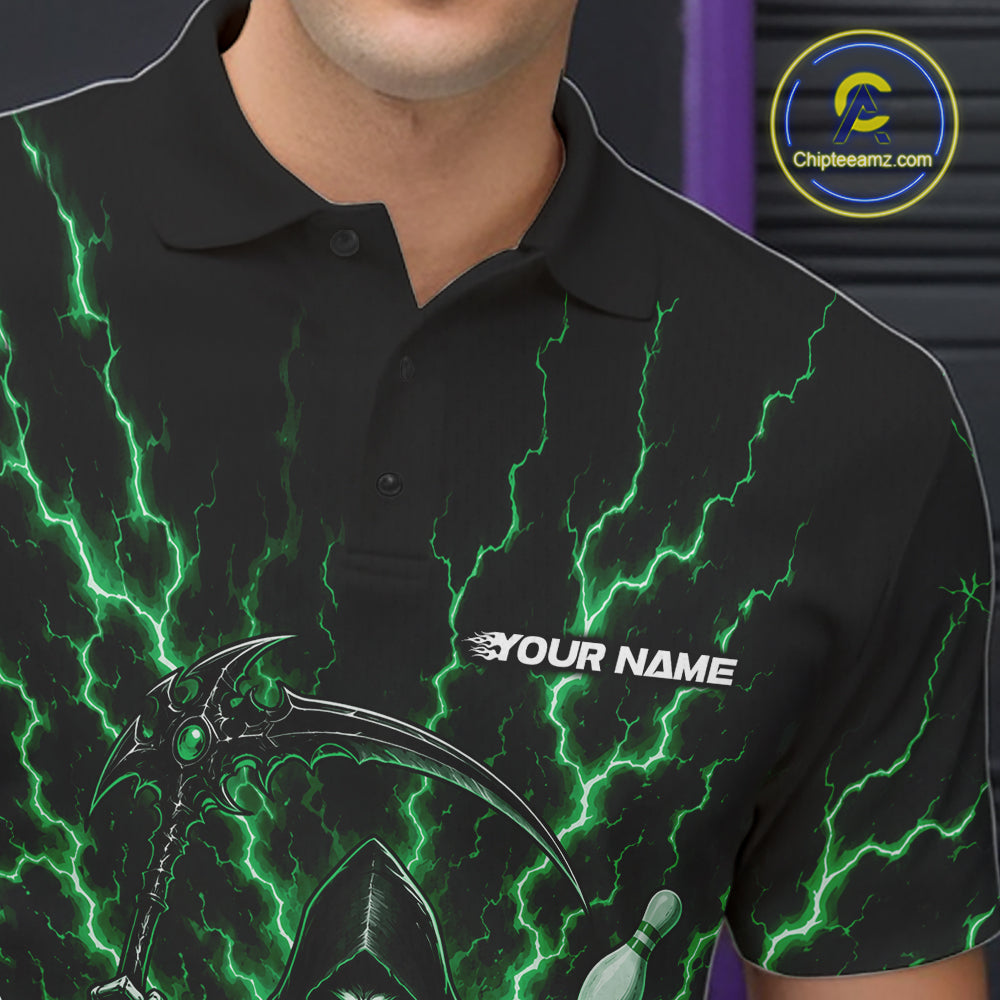 A close-up of a person wearing a black short-sleeve polo shirt with a green lightning bolt graphic pattern, a grim reaper illustration, and the text 'YOUR NAME' on the chest. 