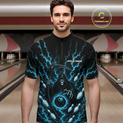 A man wearing a black short-sleeve zip-up jersey with a blue lightning and grim reaper design, standing in front of a blurred bowling alley background. 