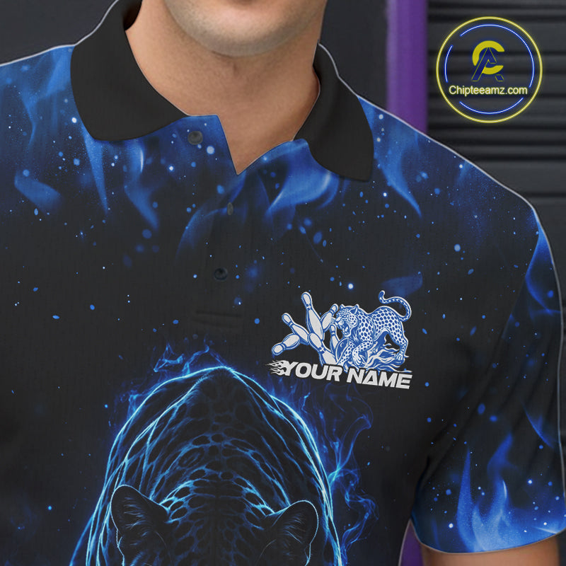 Close-up view of the left chest of a black polo shirt showing glowing blue electric panther artwork with bowling ball crashing through pins detail.
