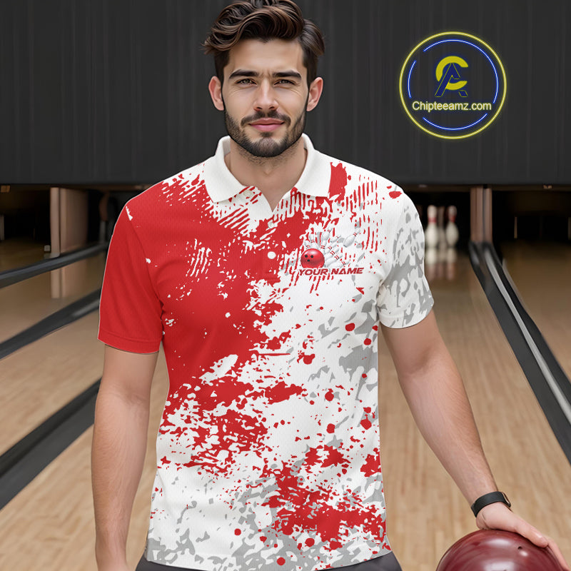 Front view of a male model in a bowling lane wearing a red and white splatter polo shirt with dynamic sporty bowling graphics.