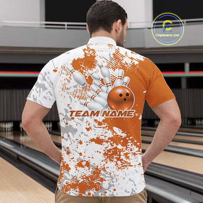 Male model in a bowling lane wearing a quarter zip shirt, front view showcasing orange and white splatter background with bold abstract sportswear styling