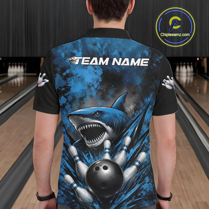 Person wearing a bowling shirt with a shark design in a bowling alley.