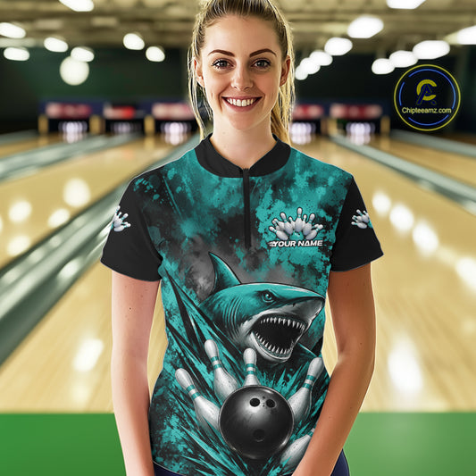 Person wearing a custom bowling shirt with a shark design in a bowling alley.
