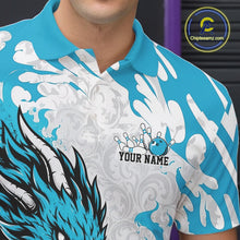 Load image into Gallery viewer, Close-up of a blue and white patterned shirt with a logo and 'Your Name' text.