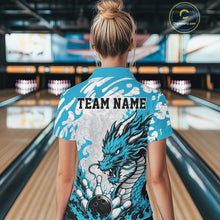 Load image into Gallery viewer, Person wearing a blue bowling shirt with a dragon design and 'TEAM NAME' text in a bowling alley.