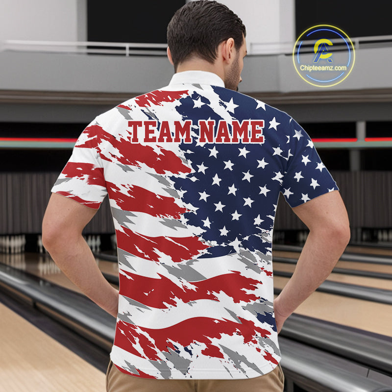 Man wearing a shirt with an American flag design and 'TEAM NAME' text in a bowling alley.