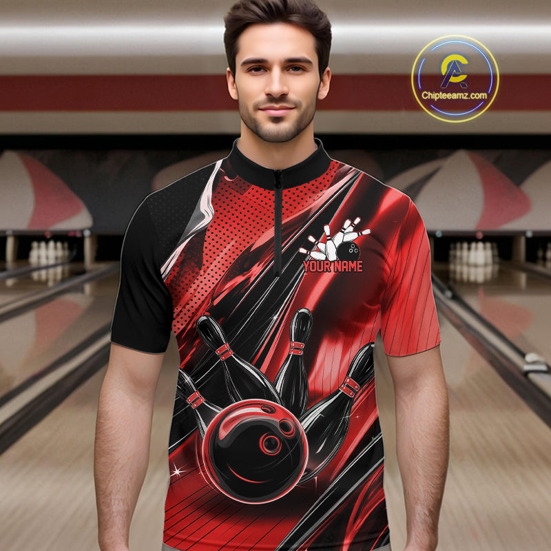 Male model wearing a black and red bowling quarter-zip shirt at the lane with dynamic bowling ball and pin artwork.