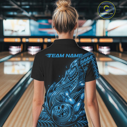 Back view of a female model in a black and blue bowling polo shirt featuring Polynesian-inspired flame motifs.