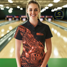 Load image into Gallery viewer, Female model wearing a black and orange bowling polo shirt at the bowling lane with Polynesian-style tribal flame graphics.