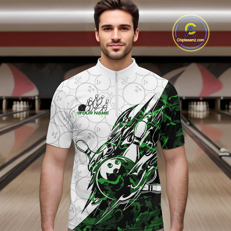 Male model wearing a white bowling quarter-zip shirt at the lane with green camo-inspired bowling graphics and faint bowling ball details.