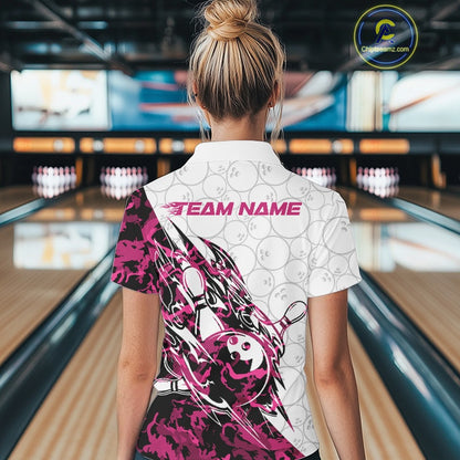 Back view of a female model in a white bowling quarter-zip shirt displaying pink camo streak artwork and bowling motifs.