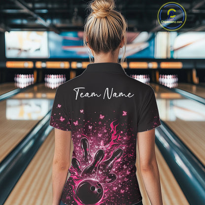 Back view of a female model in a black and pink bowling quarter-zip shirt with sparkling butterfly bowling artwork.