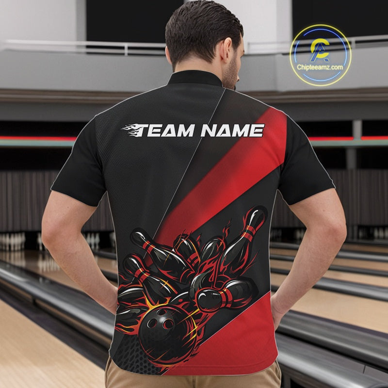 Front view of a male model in a bowling alley wearing a black and red quarter zip with fiery bowling ball striking pins in dynamic motion artwork.