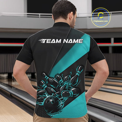 Front view of a male model at the bowling lane wearing a black and turquoise quarter zip, showcasing a fiery bowling ball hitting pins in a bold sports-themed artwork.