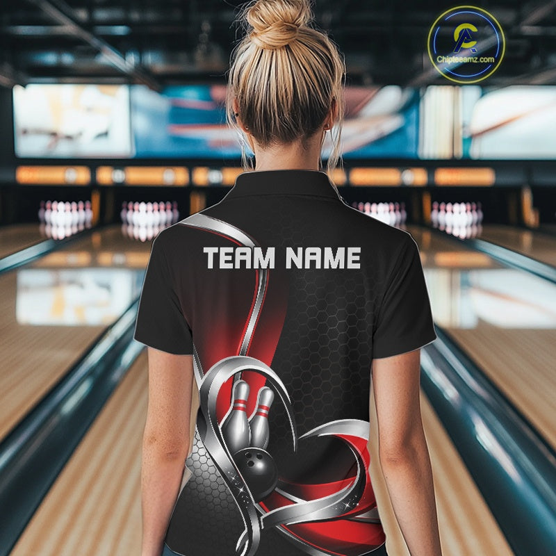 Back view of a female model in a bowling lane wearing a black and red polo shirt, showcasing honeycomb texture with a heart-shaped bowling action graphic.