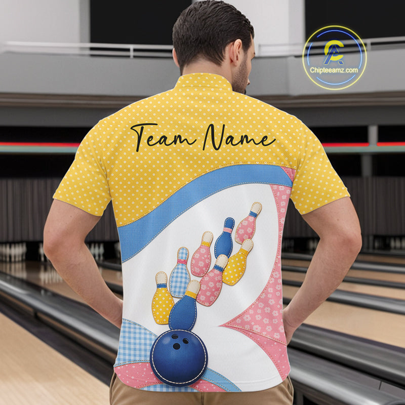 Front view of a male model in a bowling alley wearing a bowling quarter-zip shirt featuring colorful bowling-themed patchwork artwork.