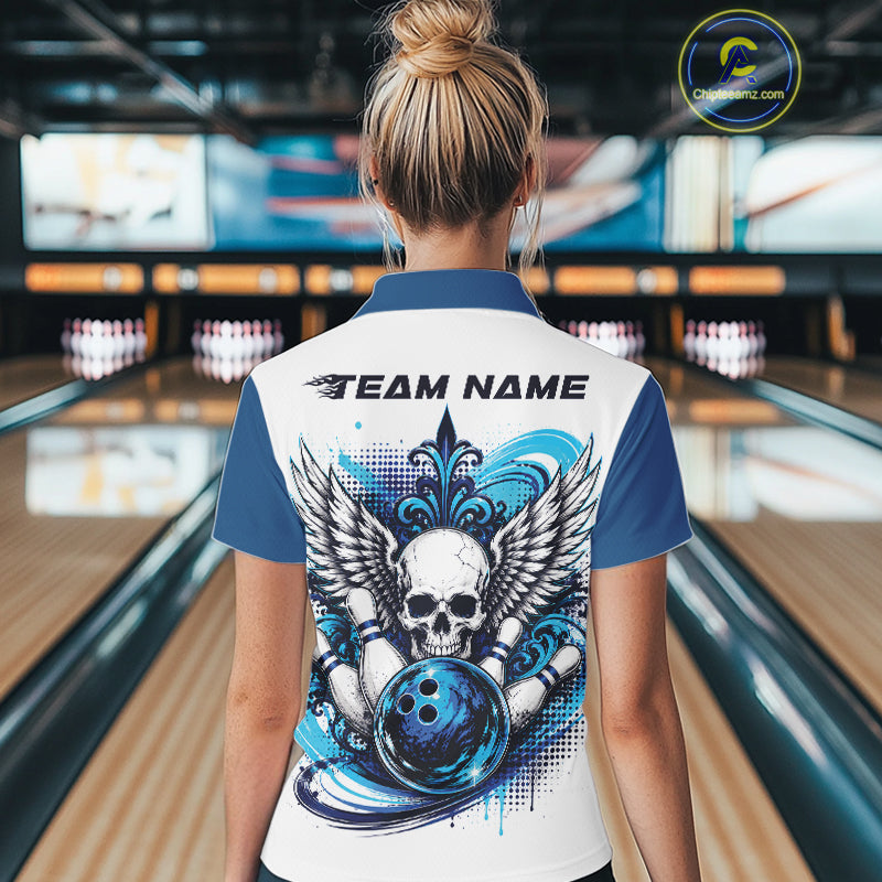 Back view of a woman in a bowling alley wearing a bowling shirt with polo collar, blue skull-themed bowling graphic with black wings, pins, bowling ball shirt with “Team Name” across the shoulders.