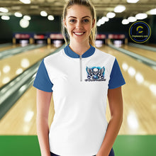 Load image into Gallery viewer, A woman stands in a bowling alley wearing a bowling shirt with quarter zip collar, blue skull-themed bowling graphic with black wings, pins, bowling ball
